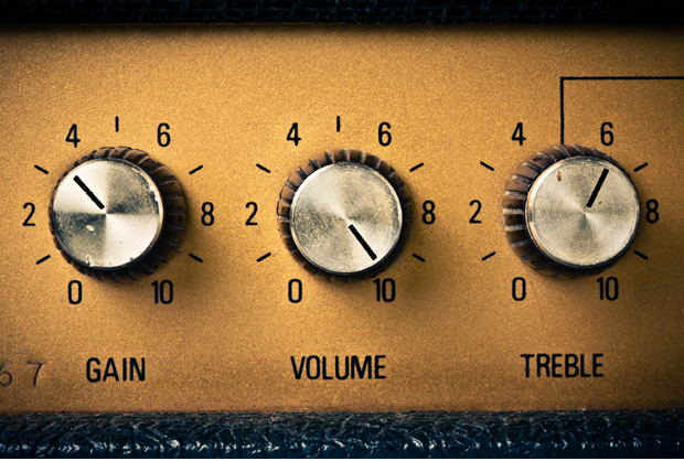 Volume knob to the max on a guitar amplifier. Retro mood.