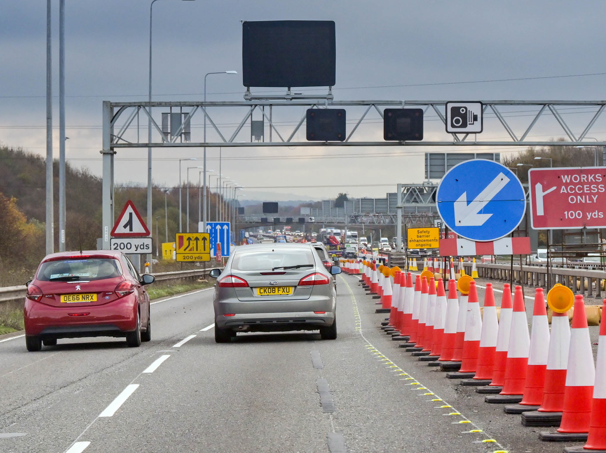 Bristol, England, UK - 29 November 2023: Traffic driving through roadworks on the M4 motorway near Bristol